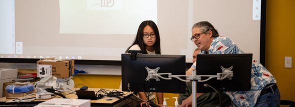 Teacher working with student