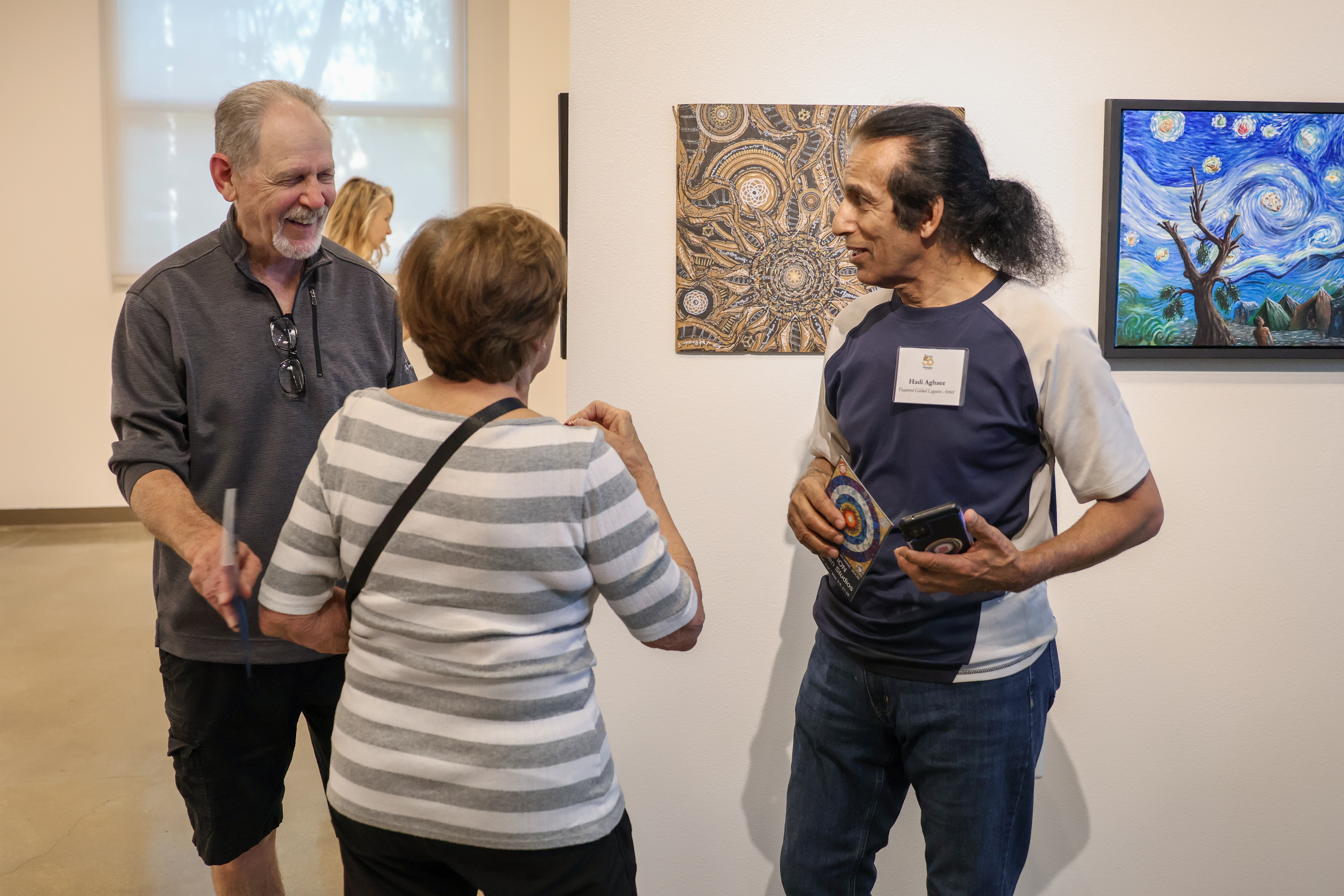 Attendees at art gallery exhibition