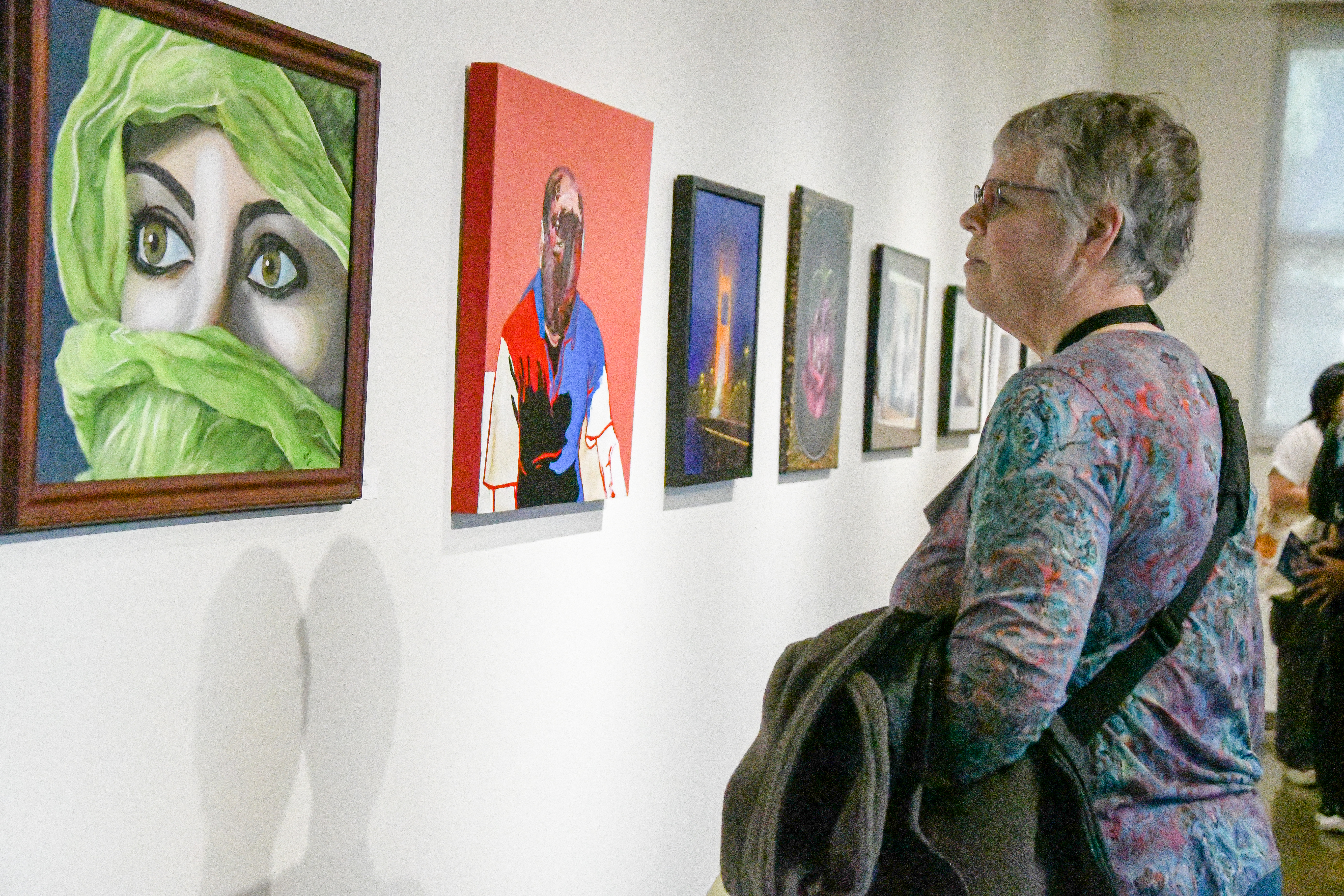 Attendees at art gallery exhibition