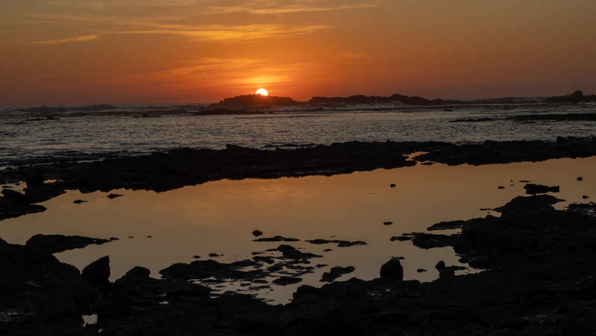 Scenic image of beach and sun