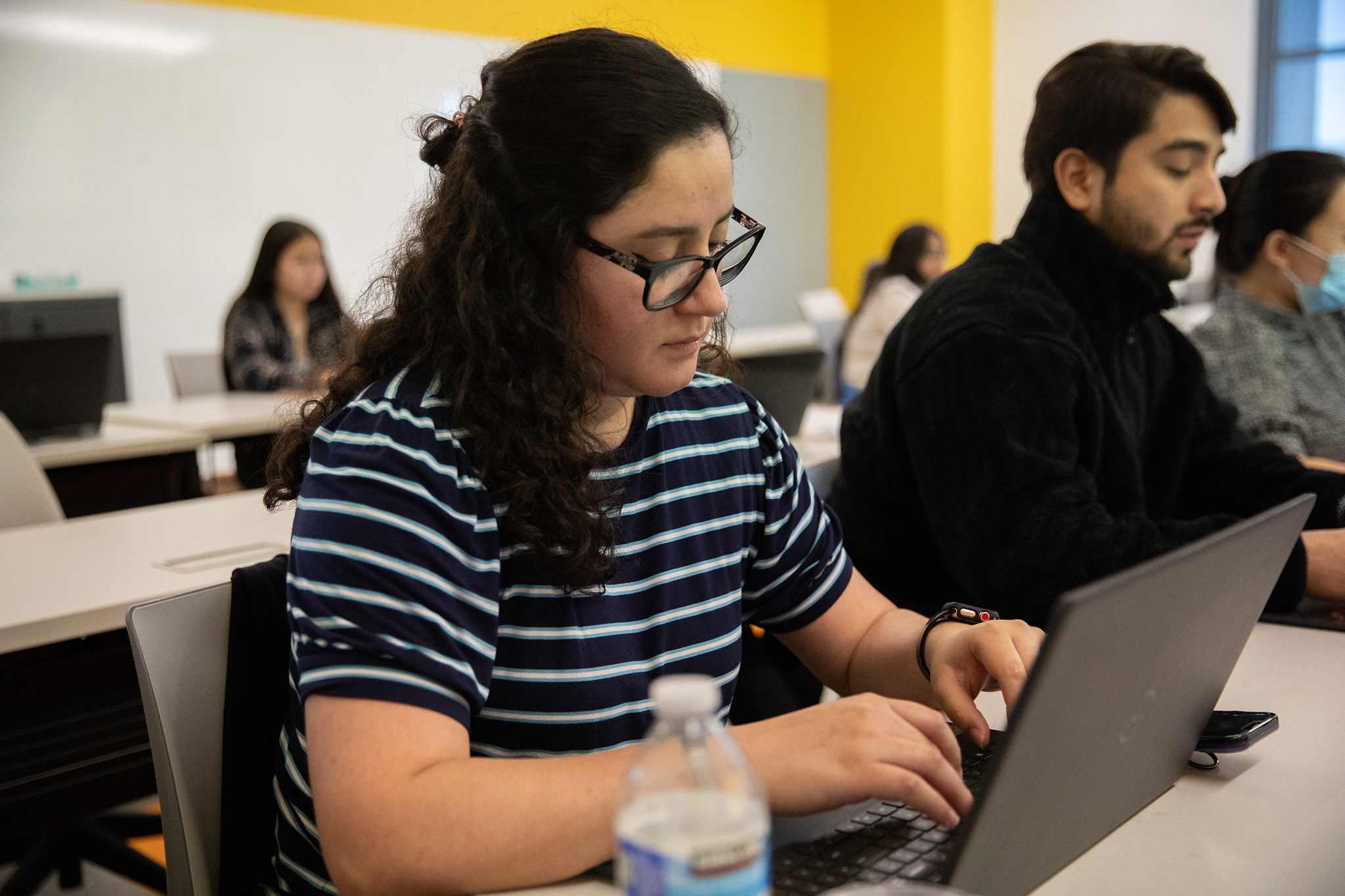 Student on a laptop in class