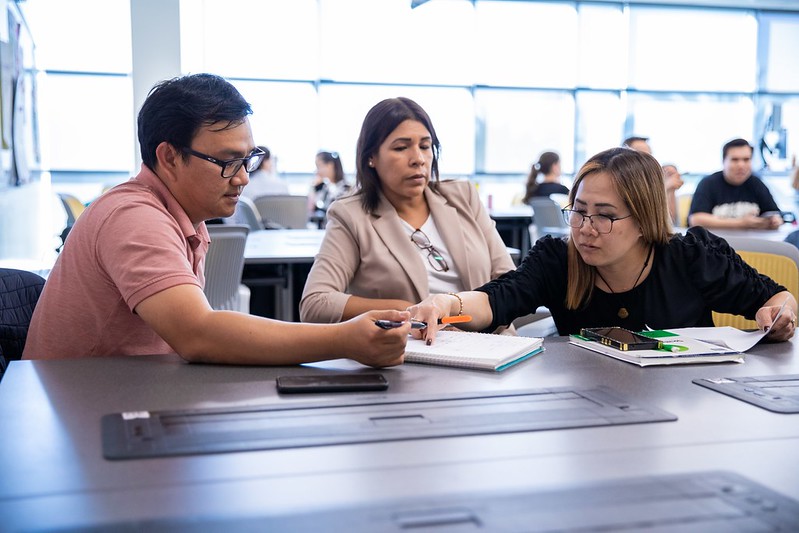 ESL Students reviewing book