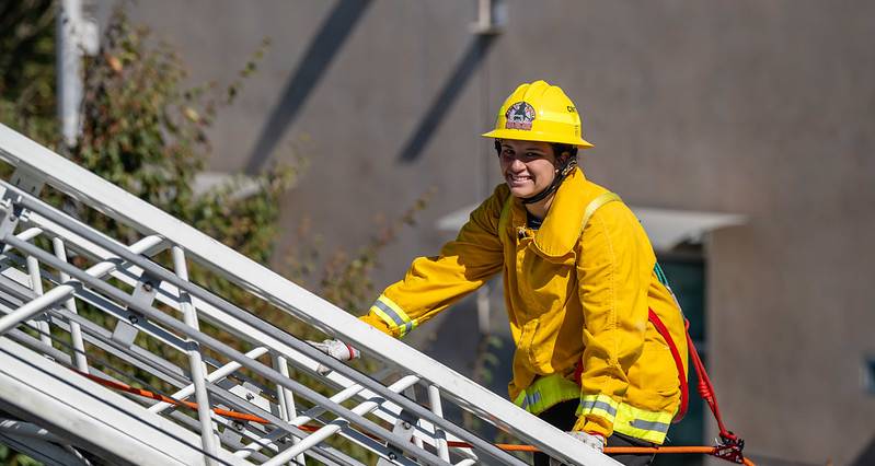 firefighter climbing ladder