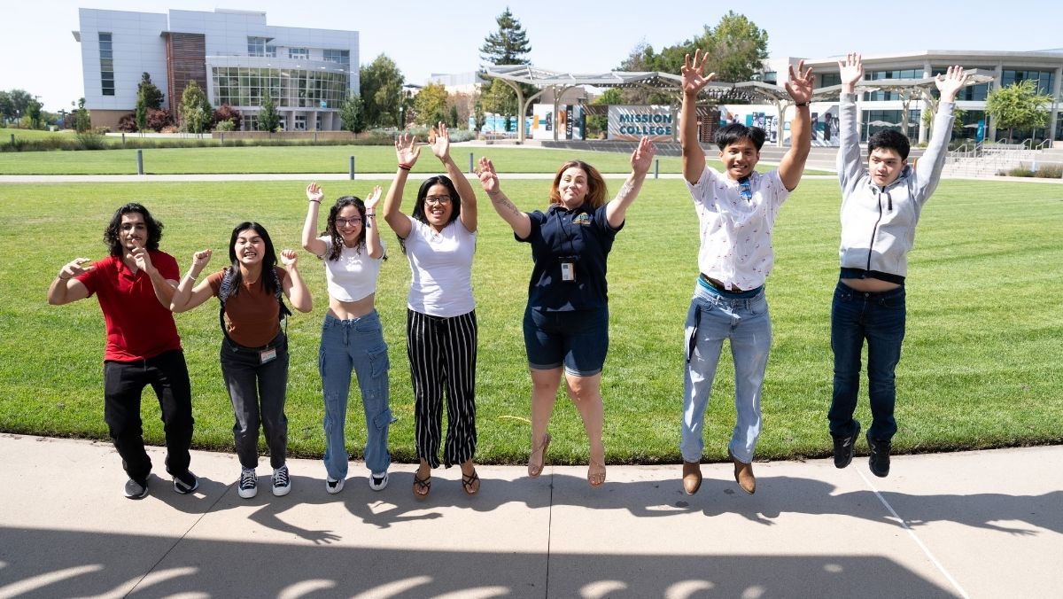 Students jumping on campus