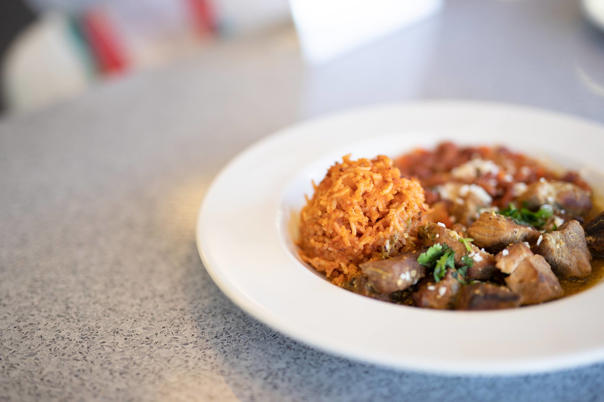 Plate of rice and meat served at the Mission Bistro