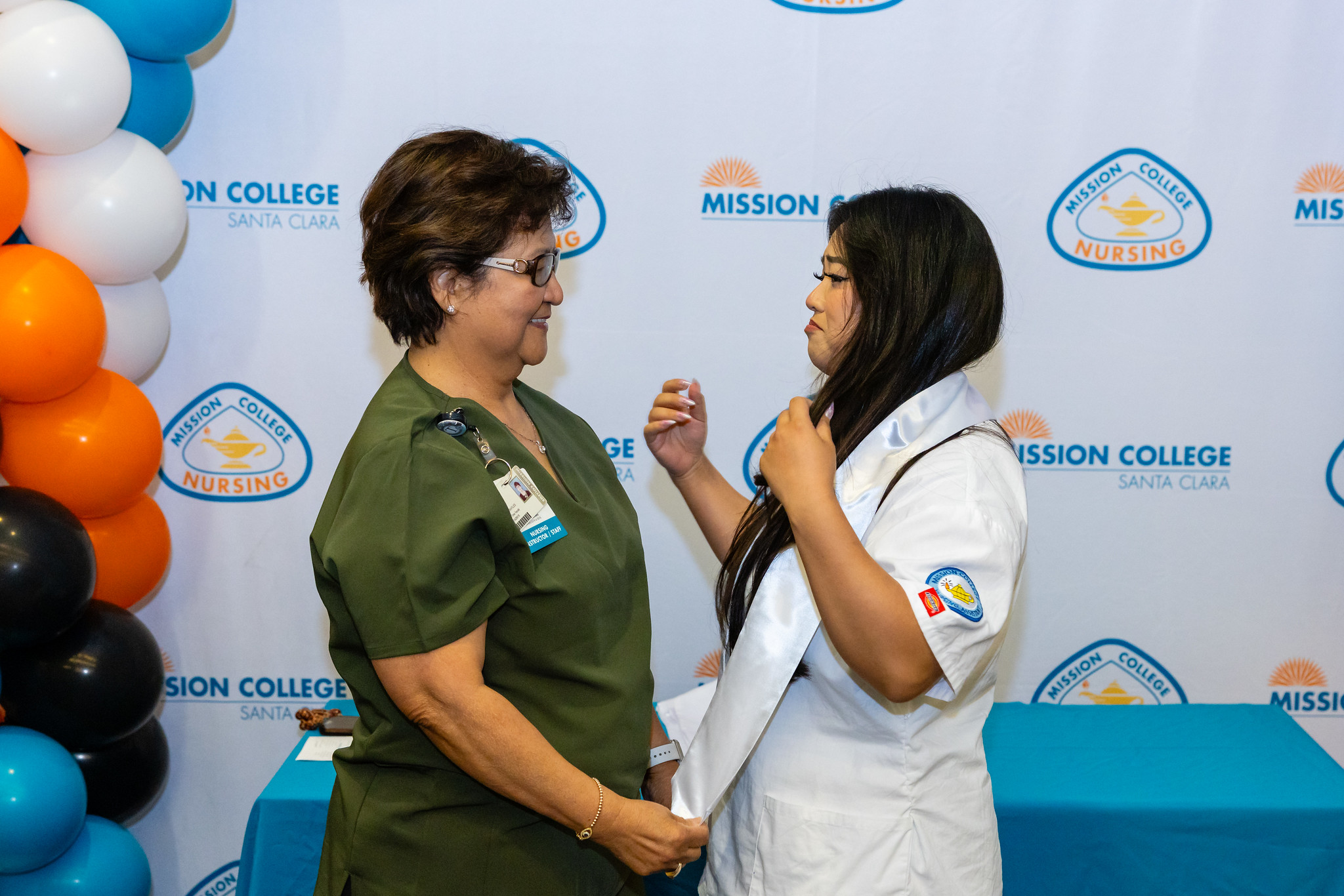 Certified Nursing Assistant graduate with faculty member