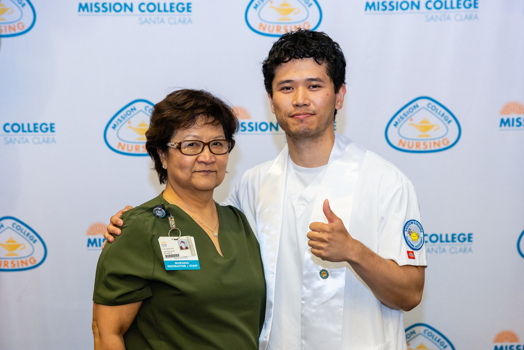 Certified Nursing Assistant graduate with faculty member