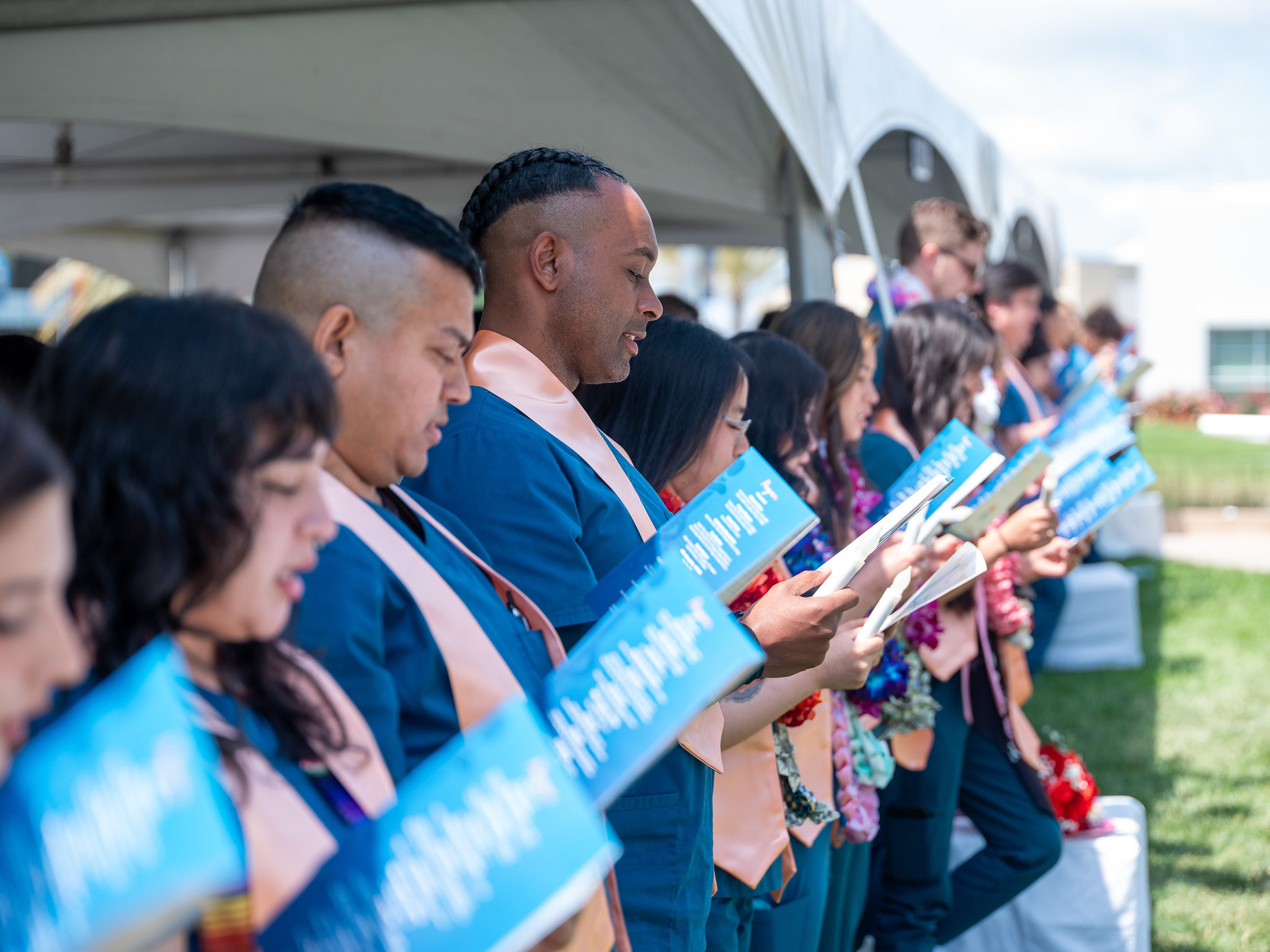 Nursing graduates looking a flyer