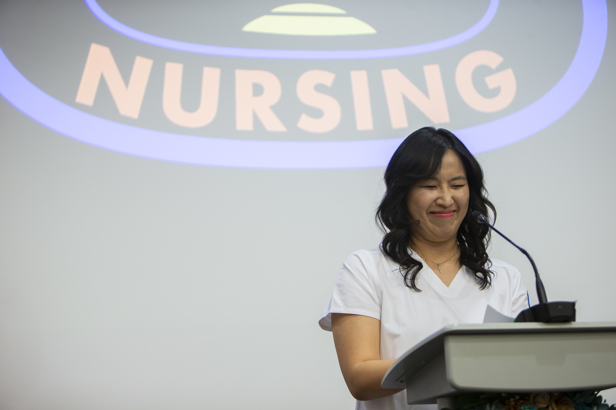 Nursing graduate at podium