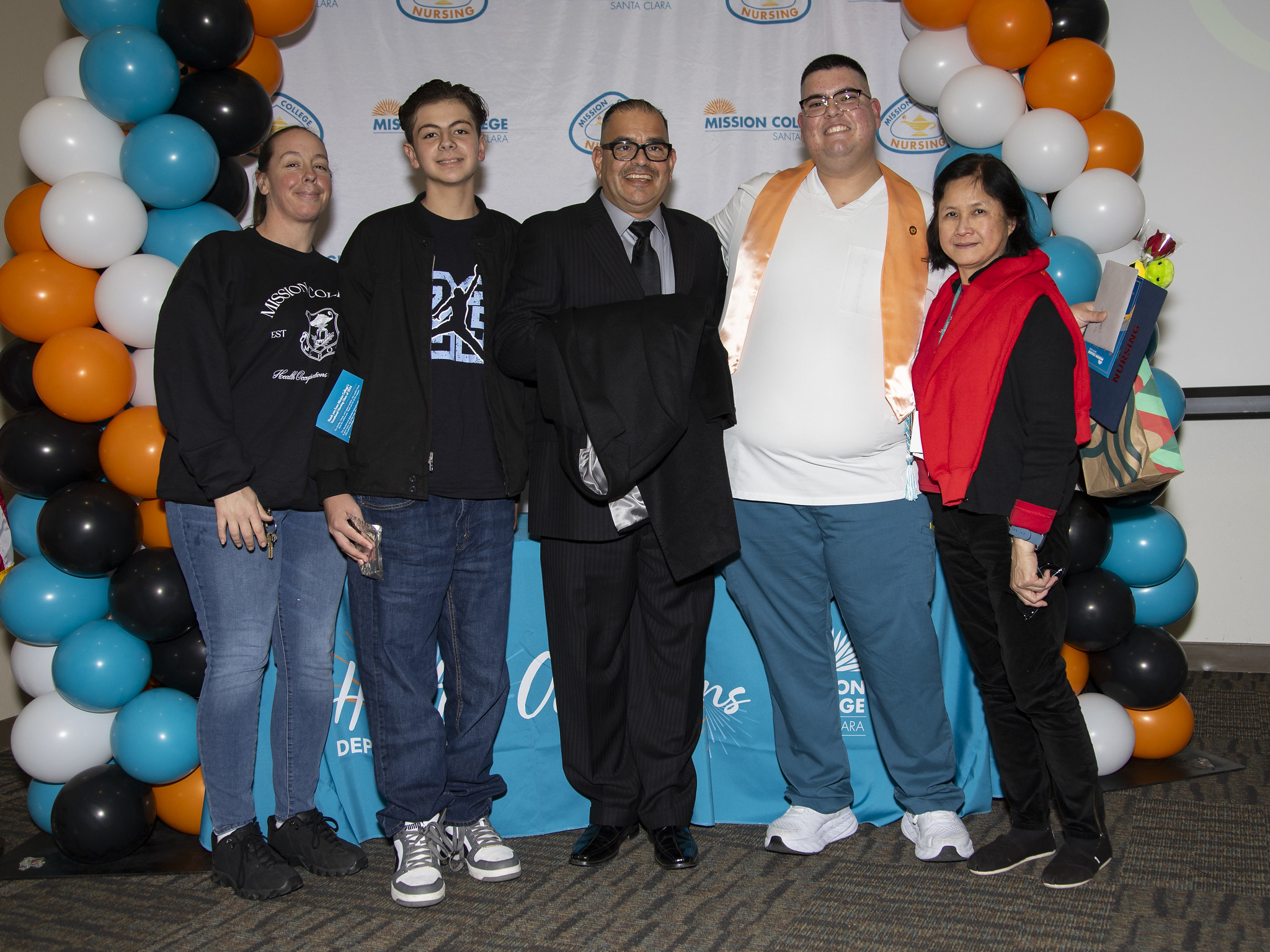 Vocational nursing graduate posing for picture with others