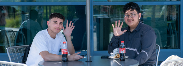 Student talking to employee