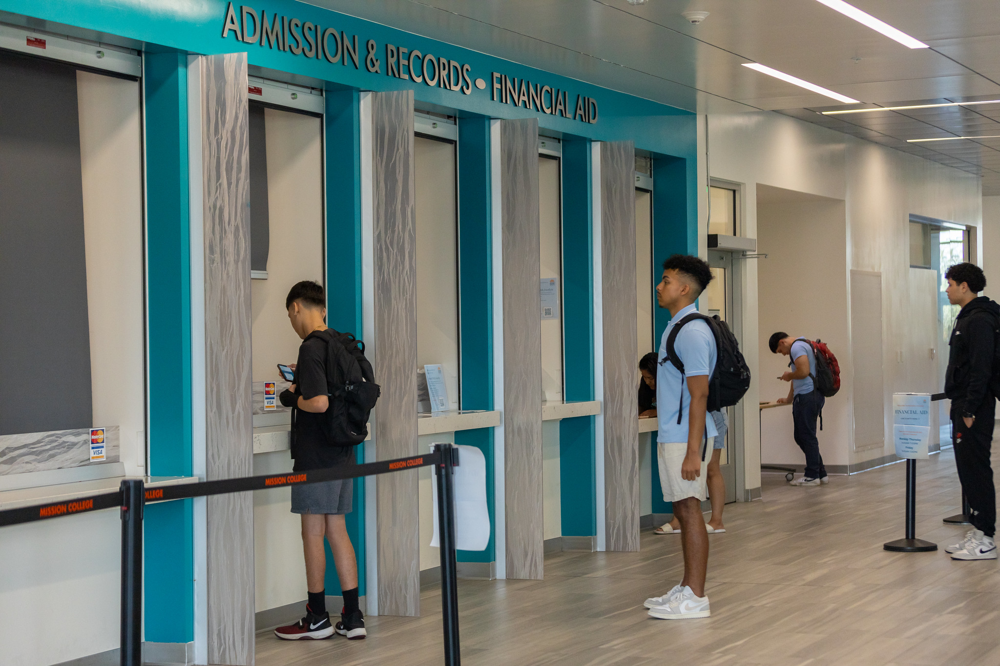 Students waiting for assistance at admissions office