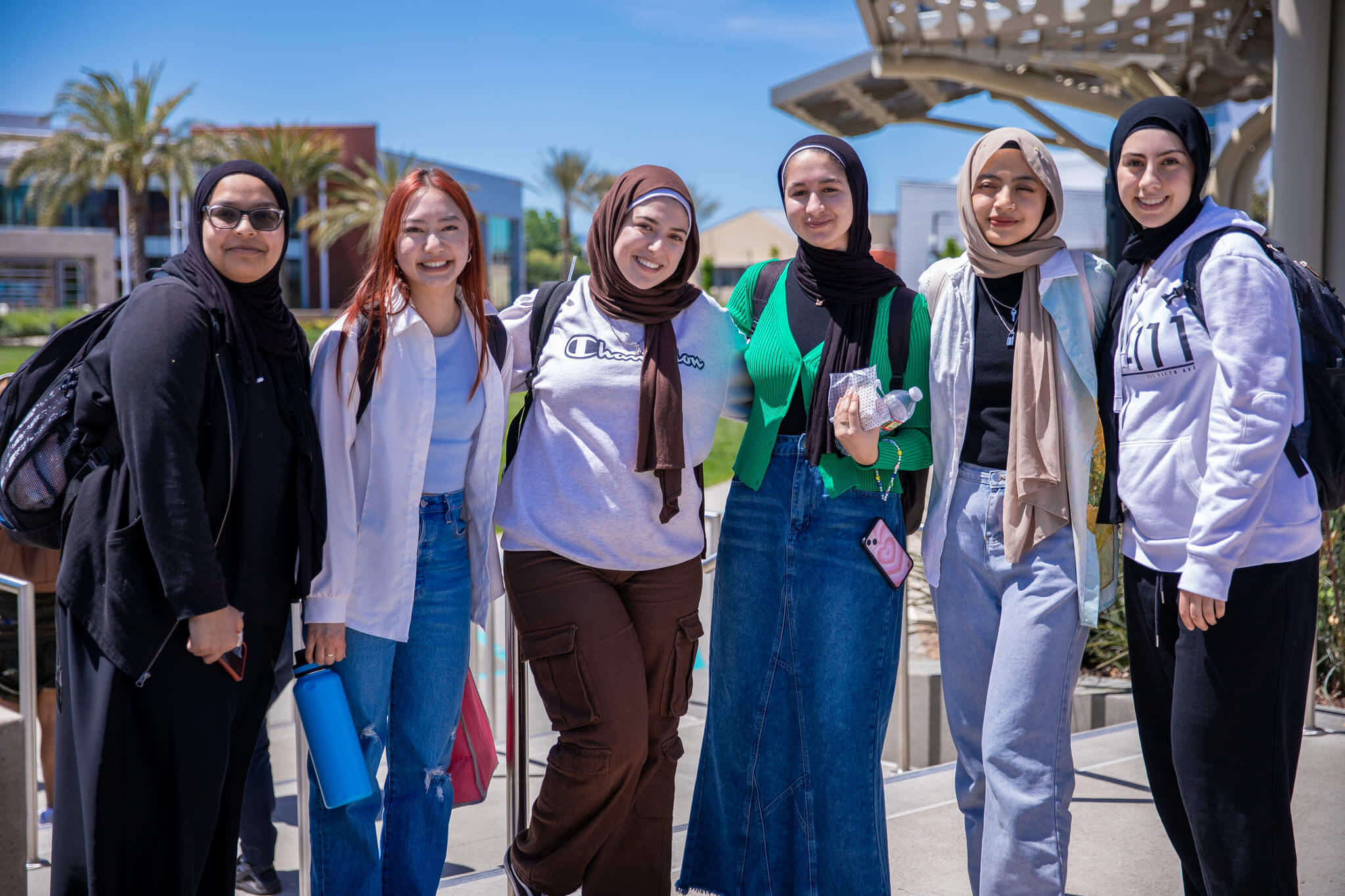 Female students posing for picture outside