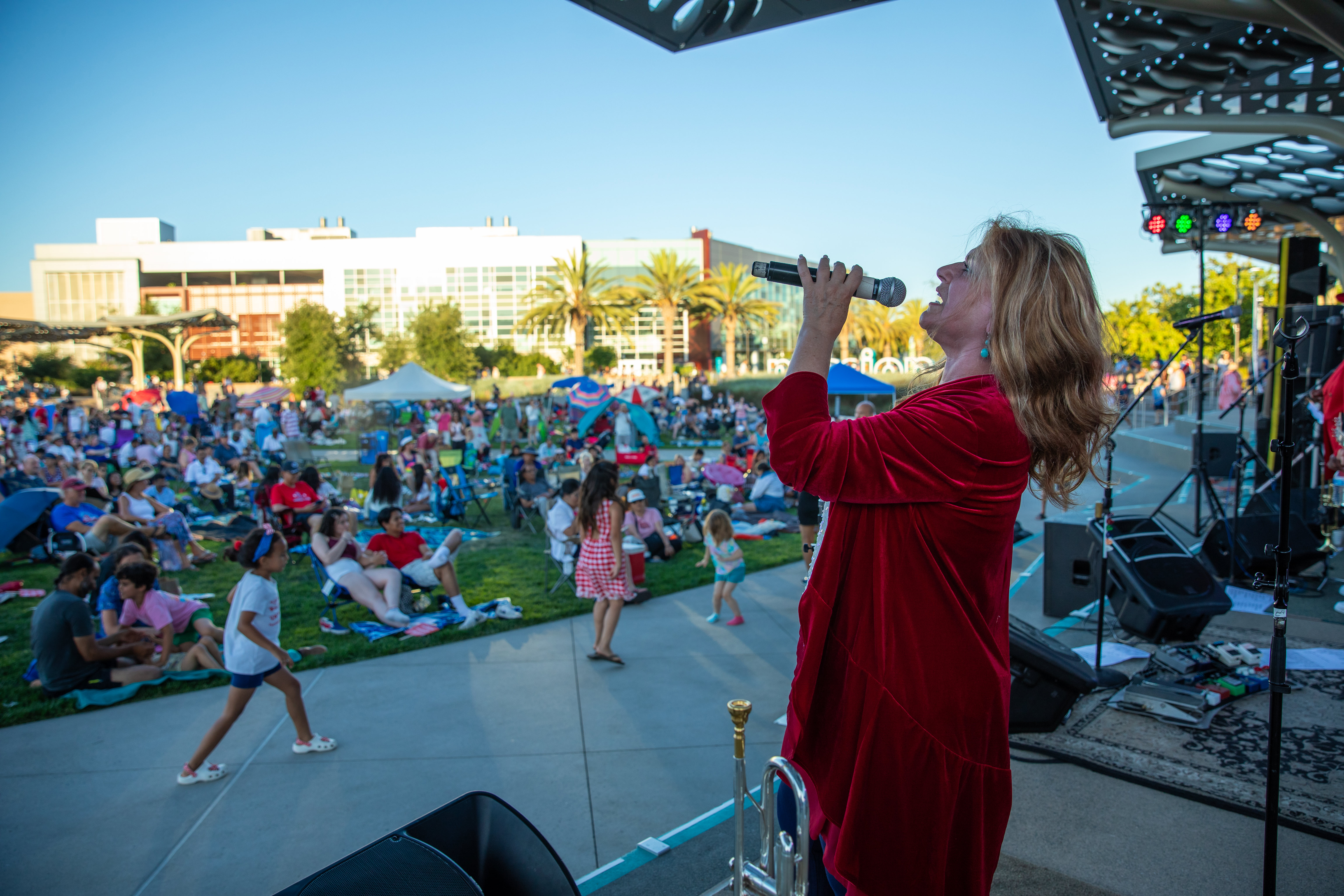 Woman singing at fourth of July celebration