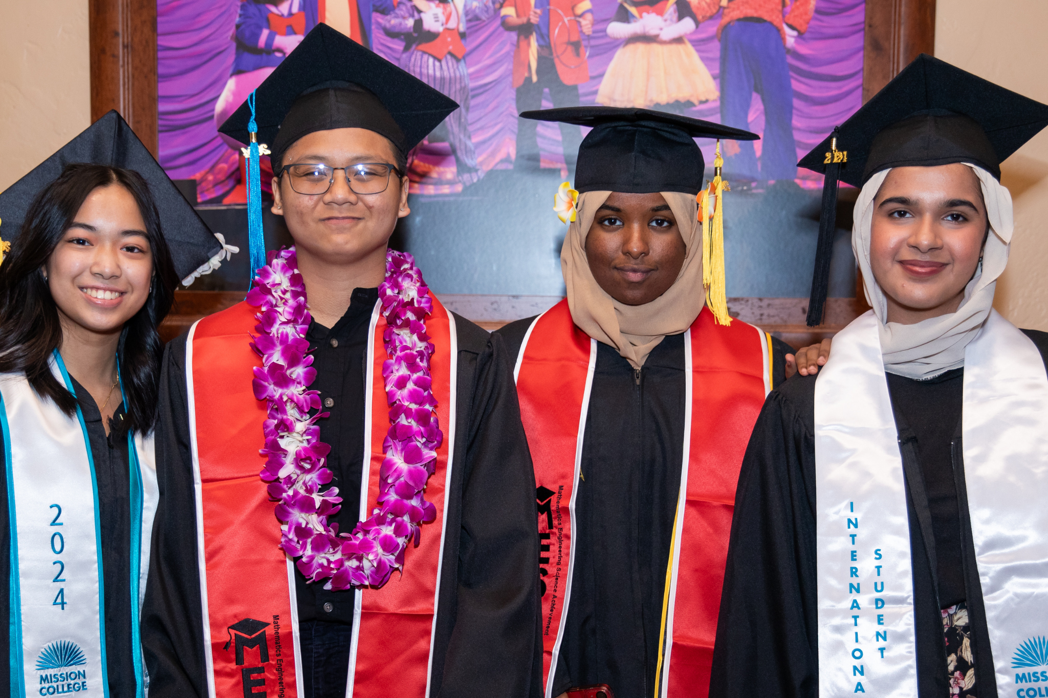 Four students smiling