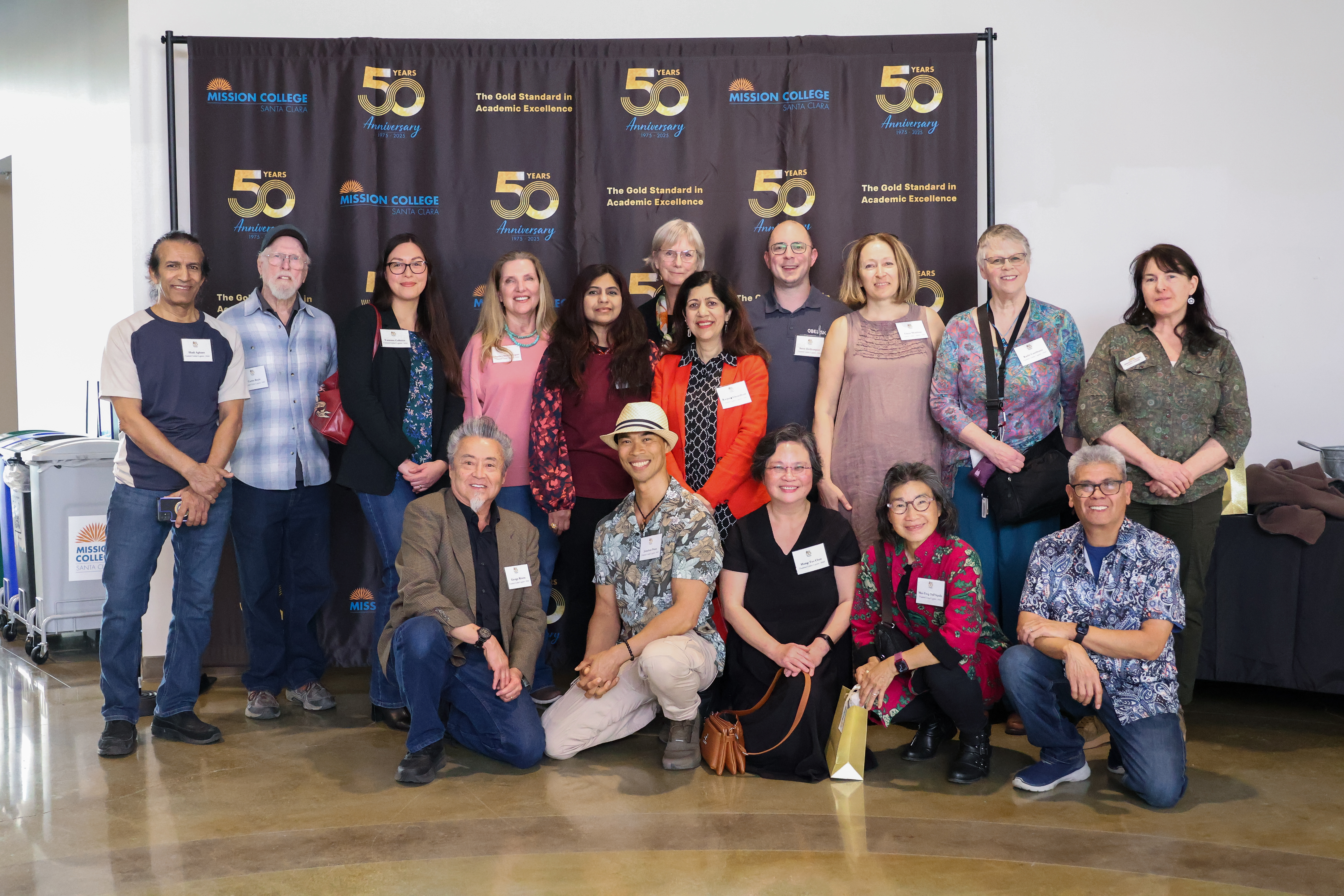 People in front of banner