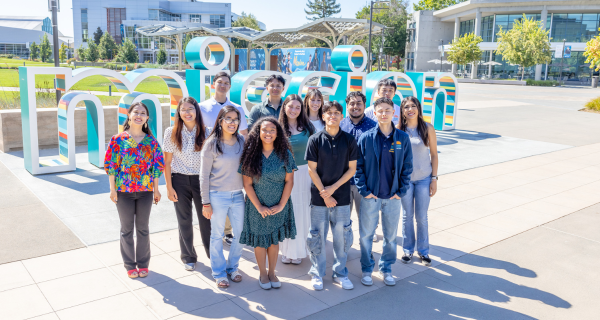 Students in front of sign