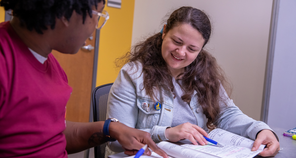 Tutor working with student