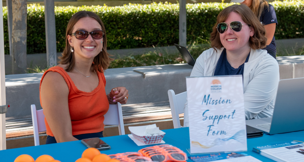 Two employees smiling