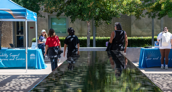 Students walking near fountain