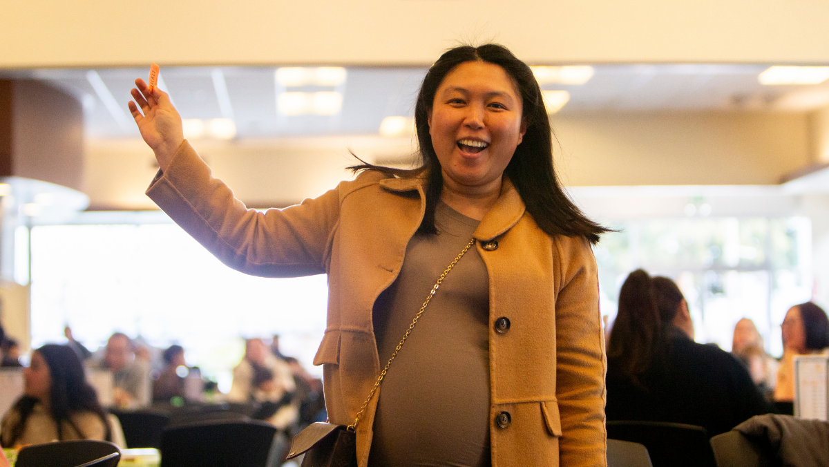 Mission College student waving