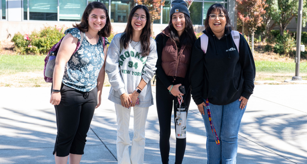 Four female students smiling