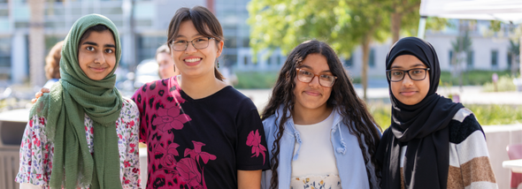 Four students looking forward