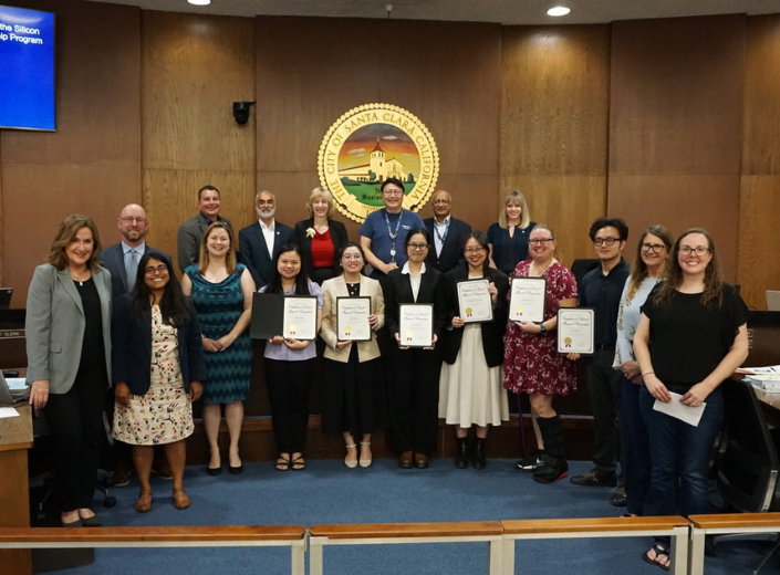 Smiling students in a government building