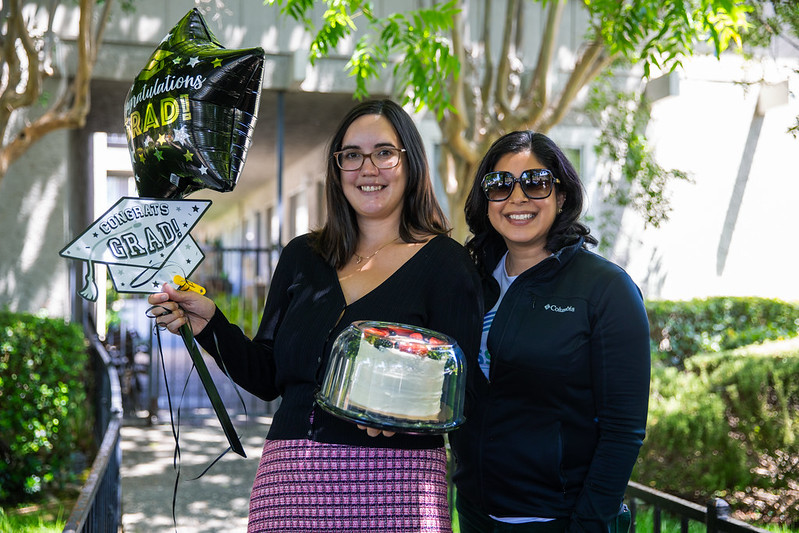 Dr. Seher Awan with student celebrating graduation