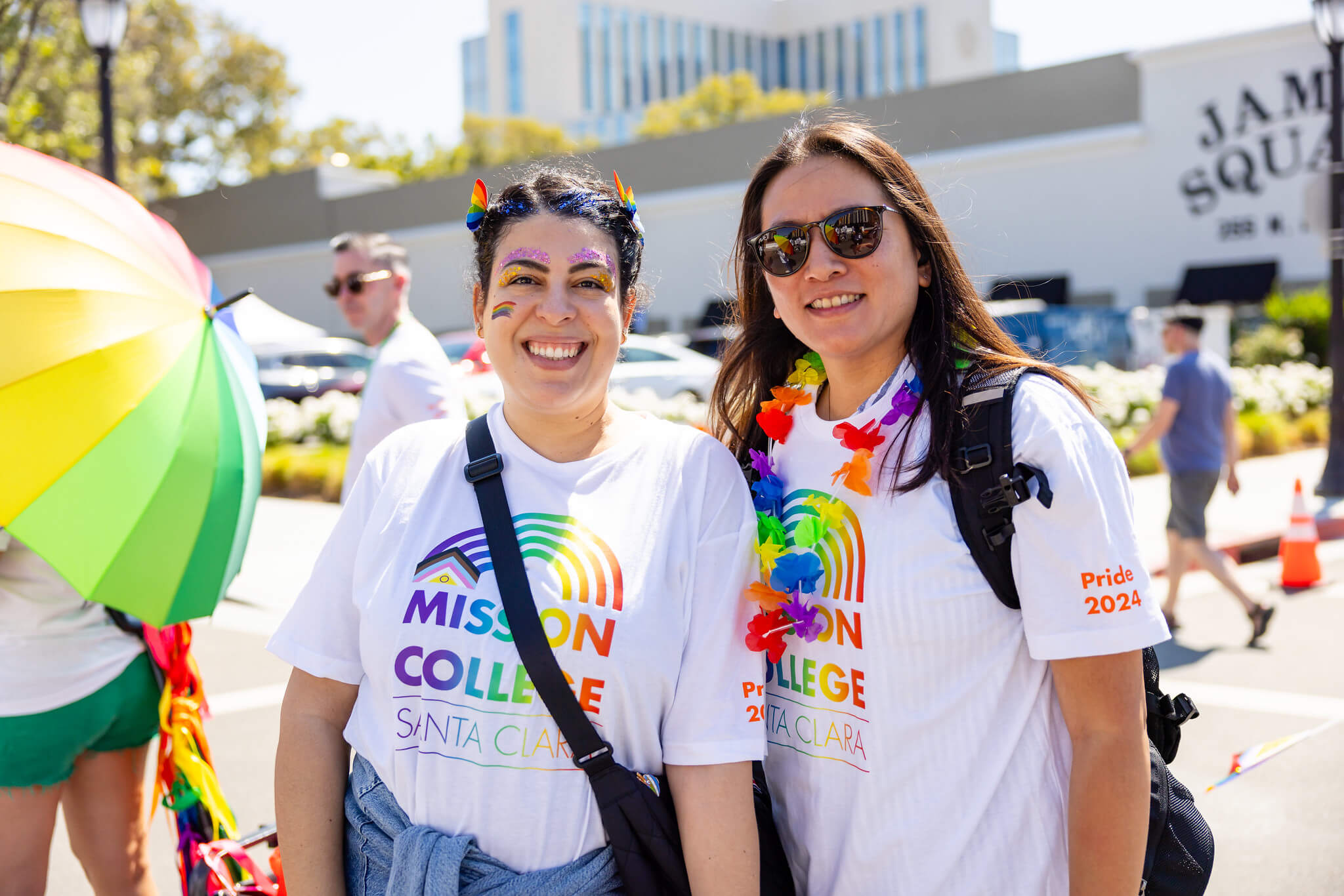 Two people participating in LGBTQIA+ parade