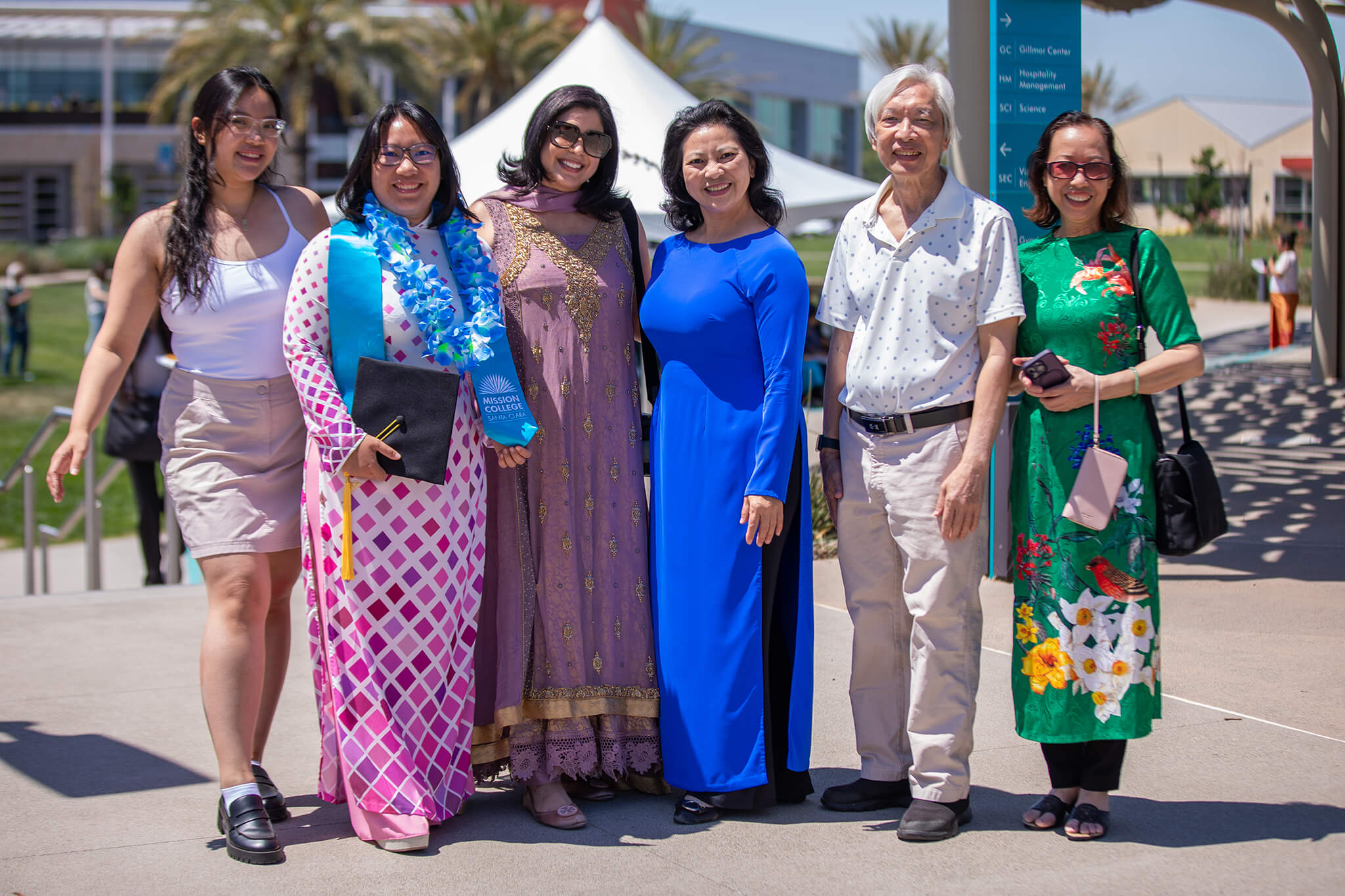 Seher Awan posing for picture outside with other people