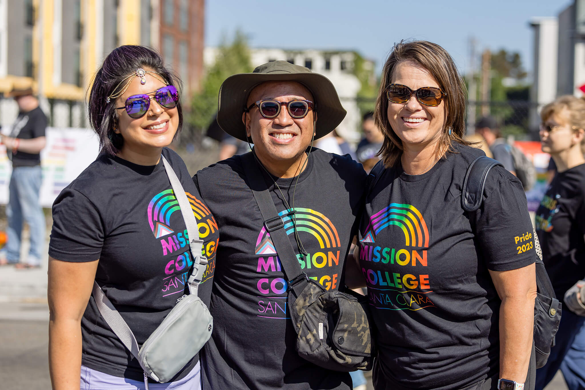 President Seher Awan with two other faculty members