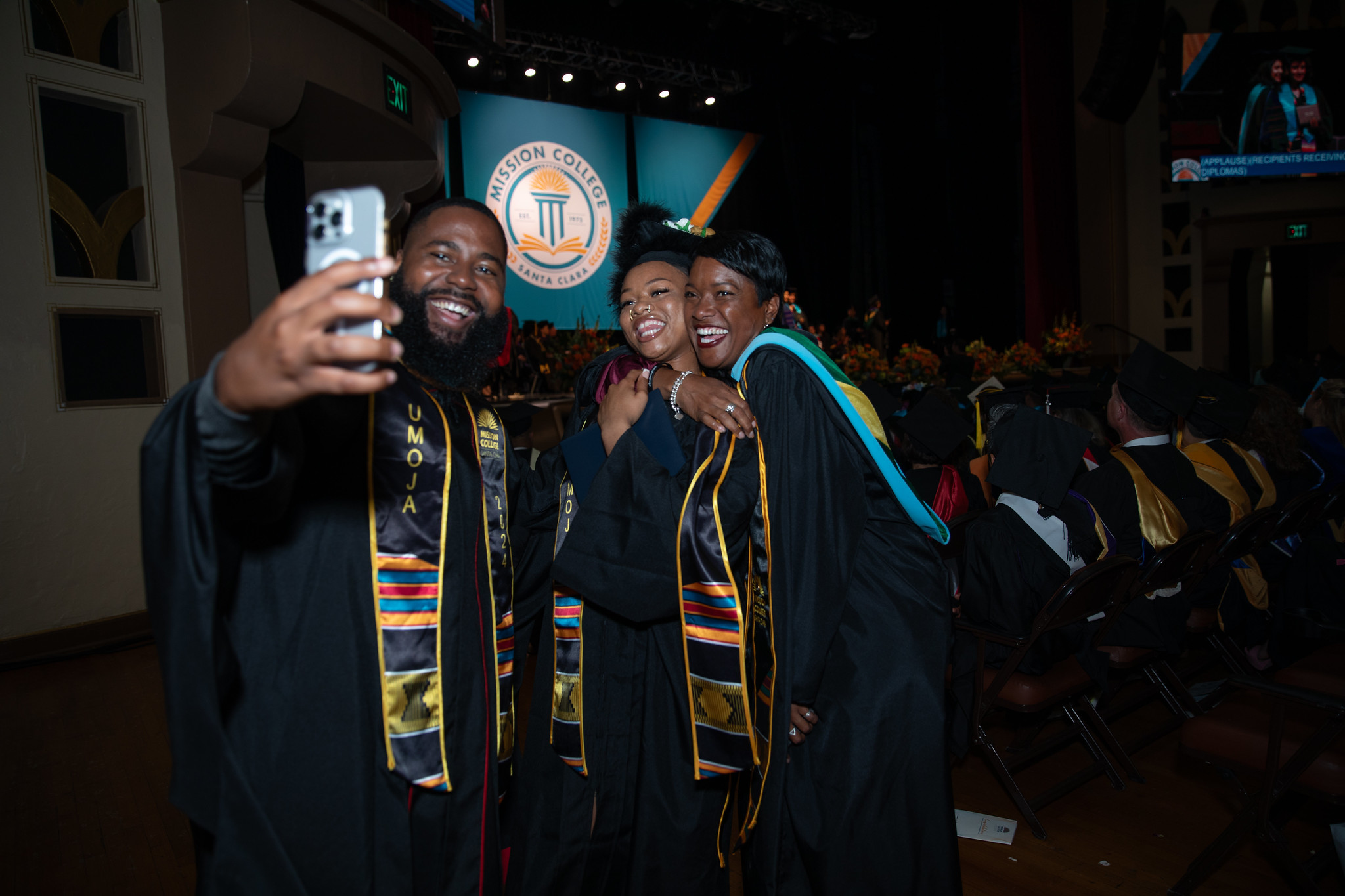 Mission College graduate with faculty