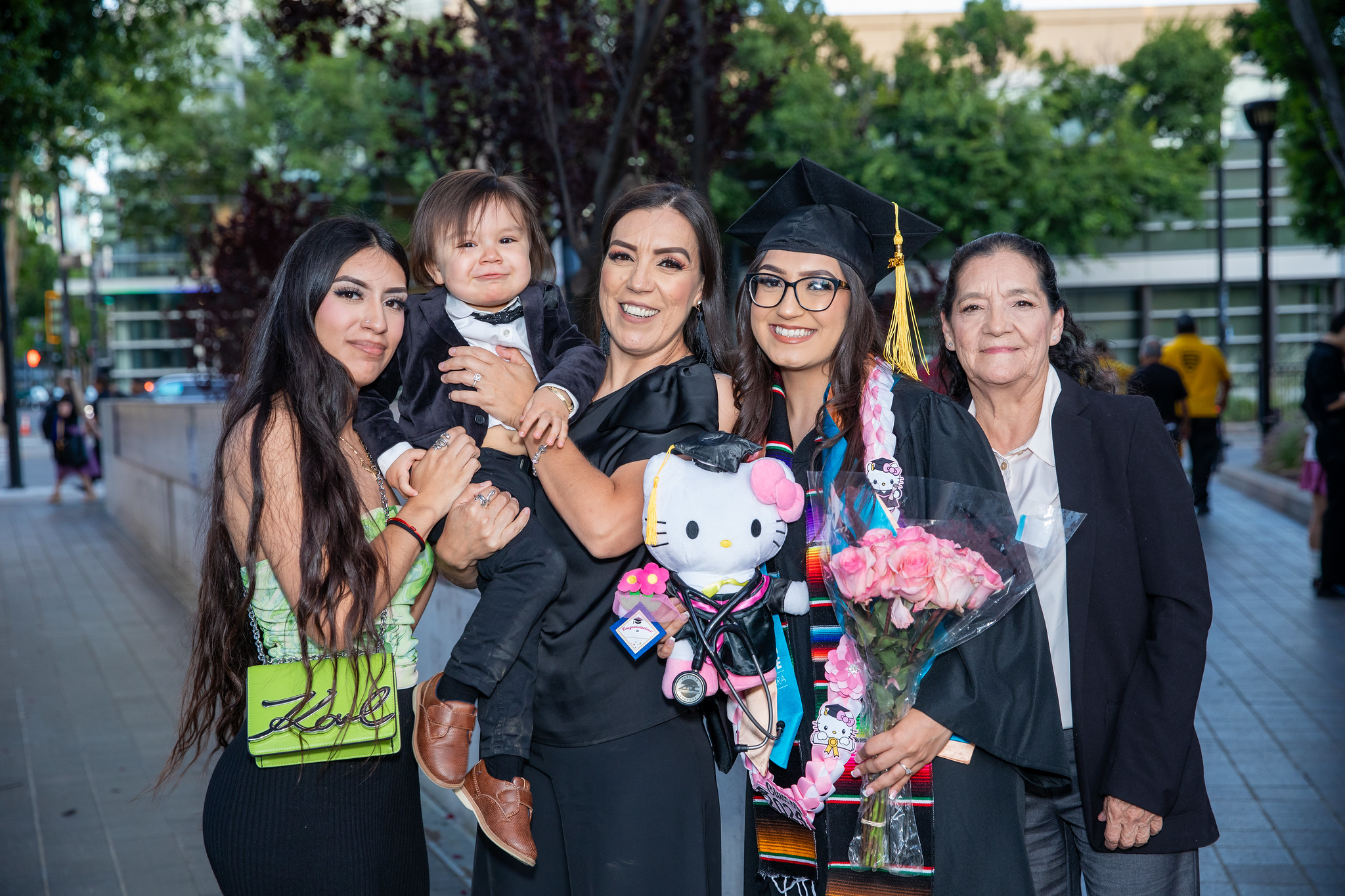 Mission College graduate with family