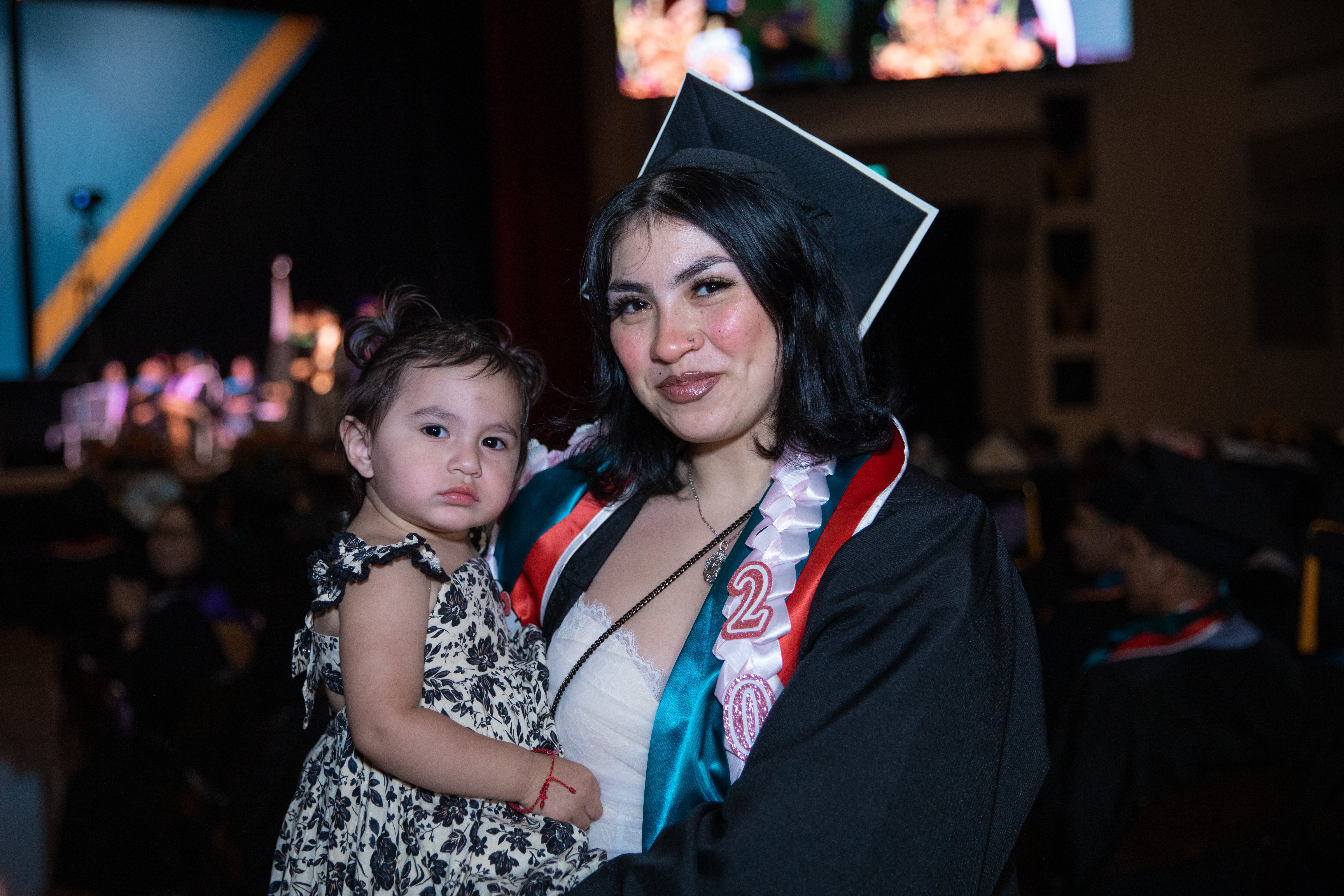 Mission College graduate with baby