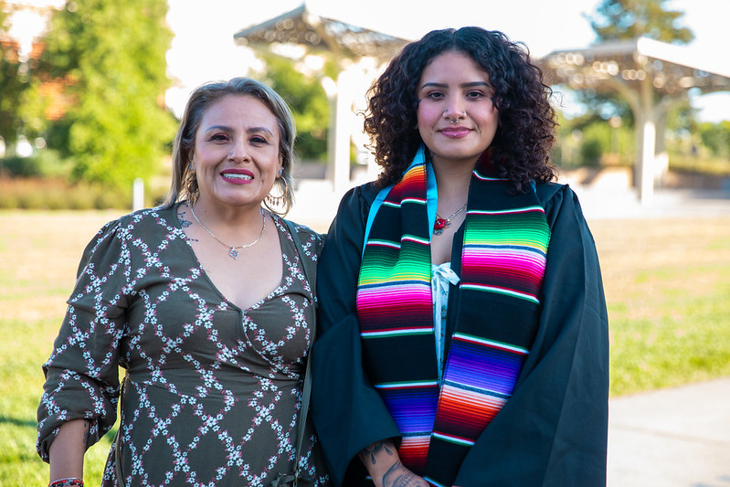 Student posing with family