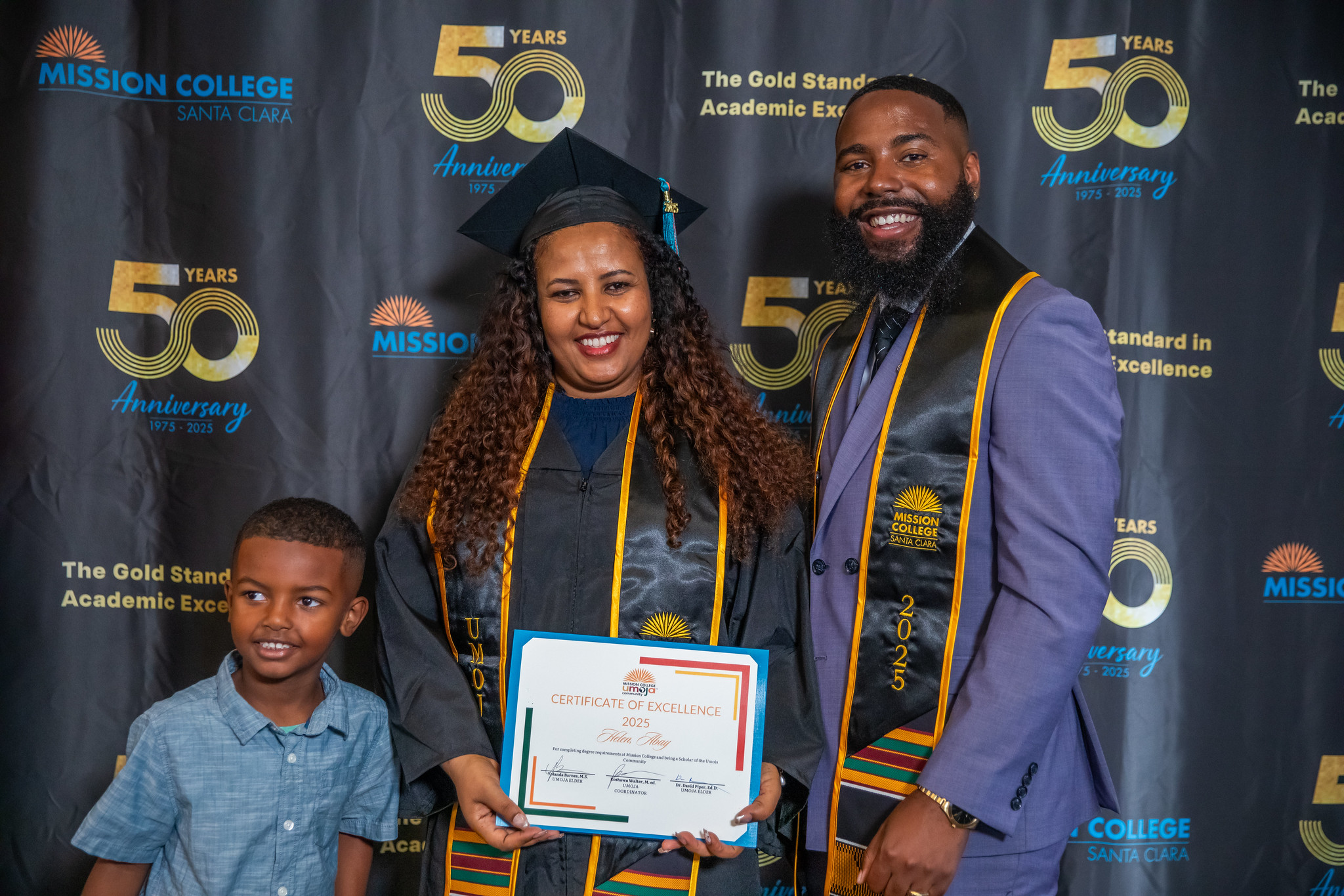 Umoja grad with faculty and child